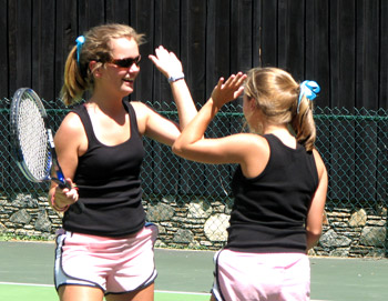 Camp Illahee counselors playing tennis