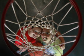 campers posing with basketball at summer camp for girls