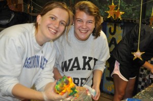 Staff practice tie-dying during orientation