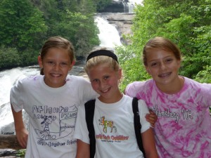 Camp Illahe girls hiking by a waterfall