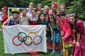 girls campers hold the olympic flag to signal start of the games