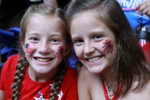 2 girls campers with red white and blue flags painted on their faces