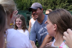 Dave Hartsock, Camp Illahee Tennis Pro, encourages girls at camp
