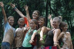 Camp girls show off their mud covered selves.