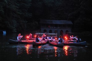 canoes in formation at Illahee girls camp on final night
