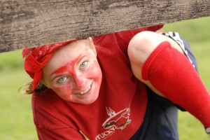girl dressed in red plays capture the flag