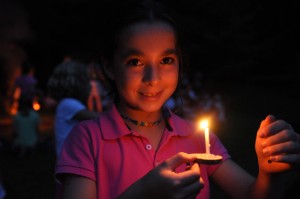 Girls floats wishboat at camp.