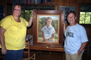 Kathy McGrady (60s) and Kathy Cabble (60s) Pose with Portrait of former Director Robin Curtis on a recent visit to he Heavenly World.