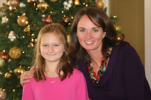 Carter and Cassie (Luce ) Plaster pose in front of a Christmas Tree.