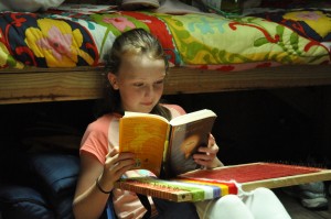Camper reads book during rest hour