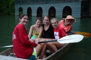 Summer campers and counselors on a boat ride.