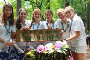 Five campers hold up 121st Psalm sign at worship.