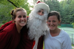 Santa poses with two summer camp girls.