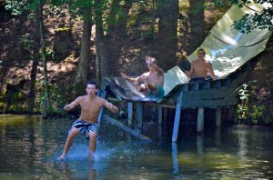 Three Christ School Boys in Rapid Succession on the Streak Water Slide at Camp Illahee.