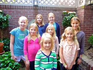 Girls from New York and Connecticut pose for a group picture in the garden.