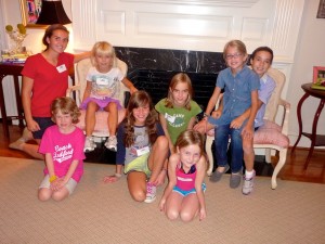 Raleigh girls in front of the fireplace.