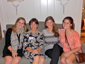 Girl's Camp Director Laurie Strayhorn sits on couch talking with Lilie Jane Hudson, Katie Cowles, and Katie Schull.