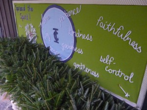 Wreathes wait to be hung below the Illahee theme sign!