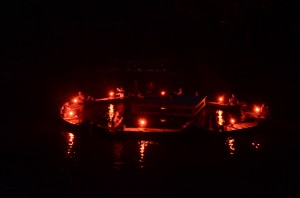 Canoes lit by candleight in a circle during Canoe Formation