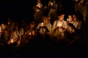 Illahee campers holding candlelit wishboats ready to float.