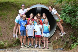 Girls with GPS units in hand pose at Illahee tunnel.