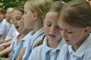 Illahee campers sing during worship in the Woodland Chapel