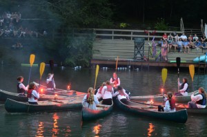 Illahee campers raise paddles during canoe formation