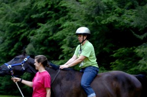 Laurie participates in pony rides at County Fair