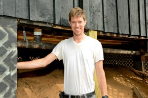 Illahee Site Manager Vincent poses before he checks on some things under a cabin on Hillbrook.