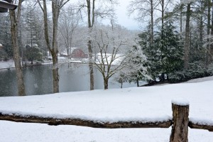 Camp Illahee Summer Camp for Girls barn is shown in a winter snow storm.