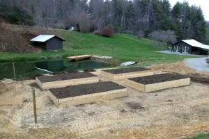 Four raised beds under construction at Camp Illahee's farm.