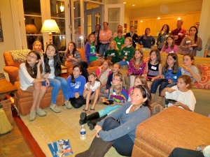 Lots of little girls look up at the screen to see the Camp Illahee girls summer camp movies.