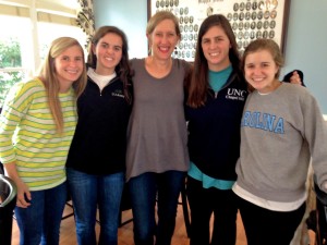 Illahee Summer Camp for girls staff director Gretchen Greene poses with 4 UNC staffers.