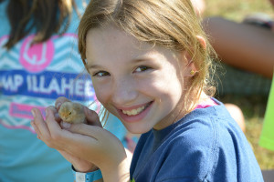 Girl holding chick