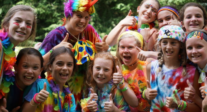 rainbow clad campers pose before competing in the Illahee Olympics