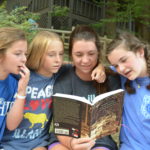 Campers reading about Illahee's past