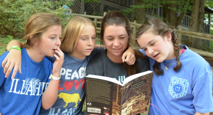 Campers reading about Illahee's past