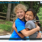 2 Girls Hug at the end of an activity movie.